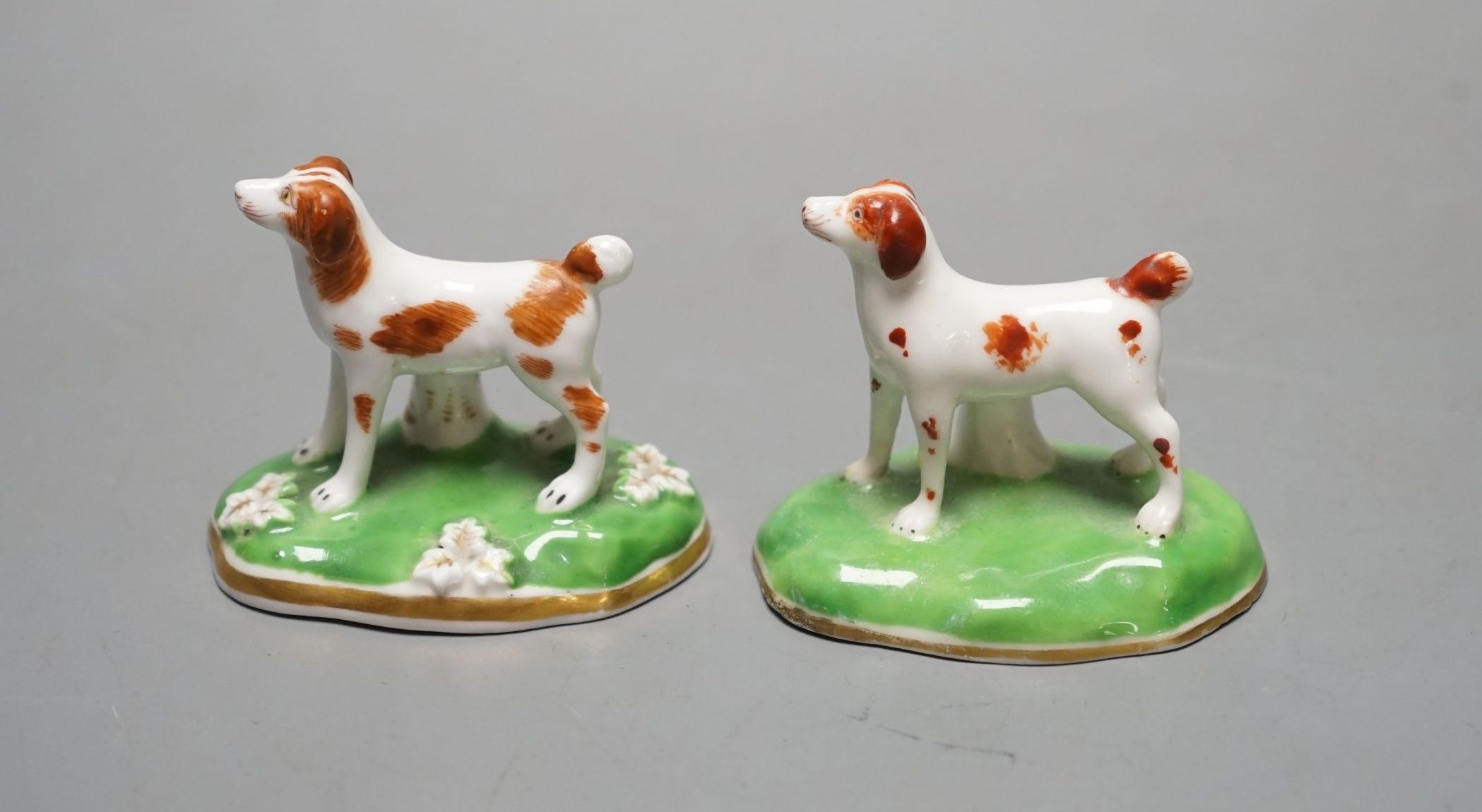 Two Chamberlains porcelain toy models of a pointer, c.1847-52, one with leaf moulded flat base, impressed CHAMBERLAINS, the other with plain concave base and unmarked, cf. Dennis G.Rice, Dogs in English porcelain, colour
